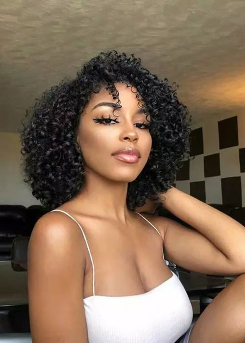 9 Trending Curly Weave Hairstyles of 2022 To Impress Your Clients With