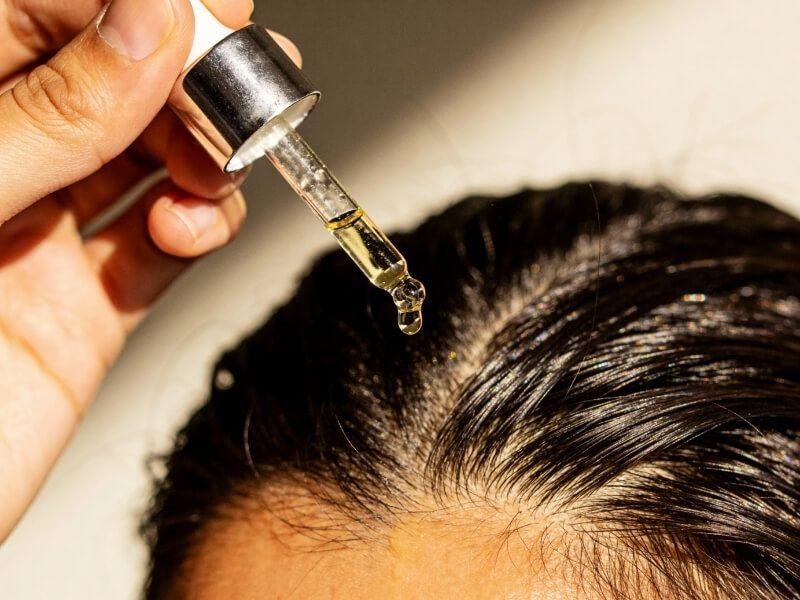 Apply a lightweight oil or edge protector before putting on your wig