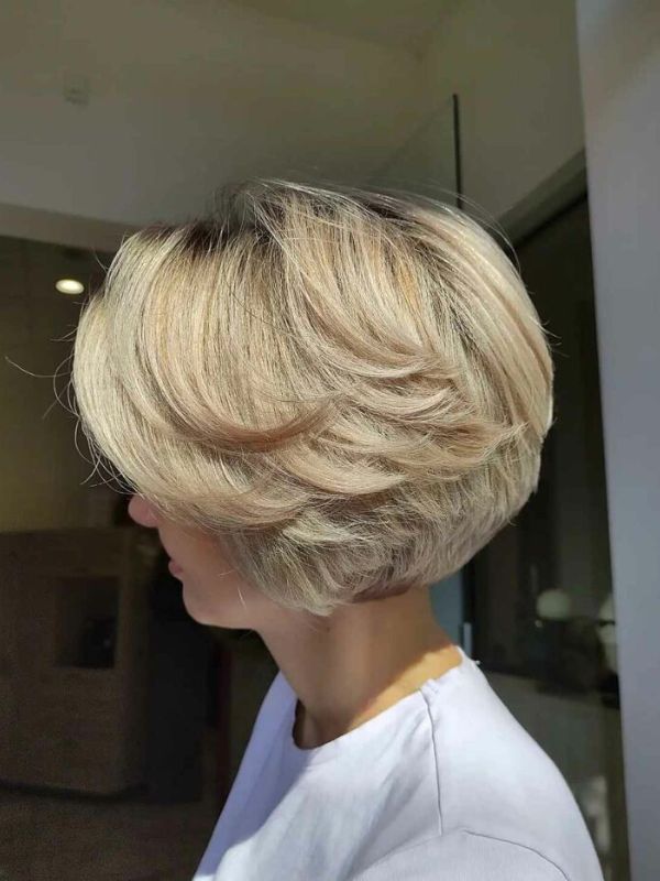 Girl with Bob with Feathers hairstyle viewed from the side