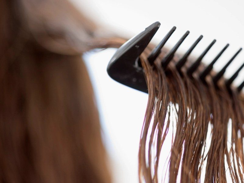 Detangle your hair using a wide-tooth comb