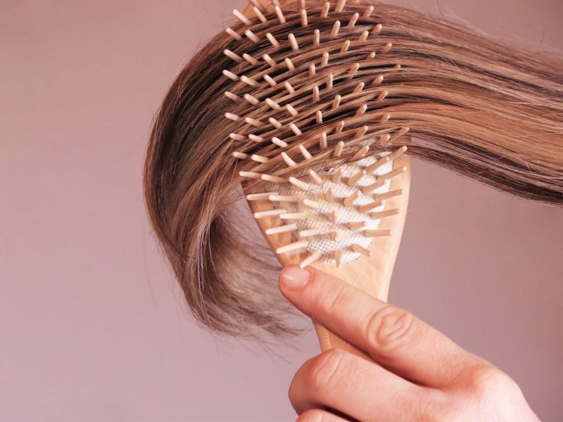 Brushing hair regularly to reduce tangle 
