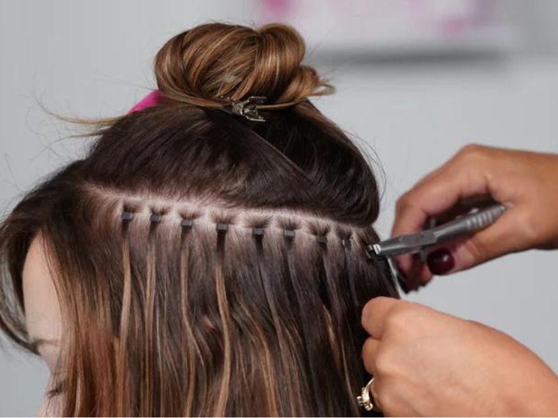 Apply keratin hair extensions with tiny beads