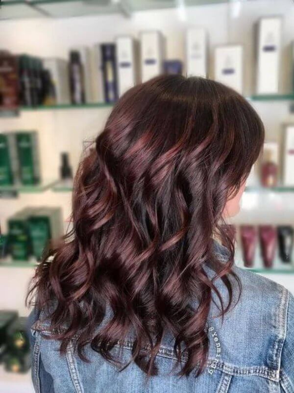 Add lively curls and brown light burgundy with lighter highlights for a vibrant look