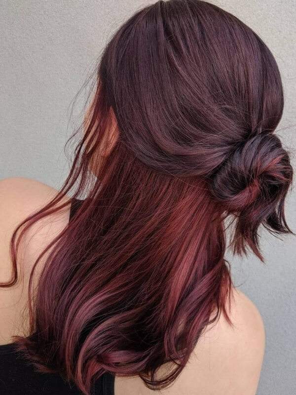 Add a playful touch with hidden hair color highlights that peek through your natural hair