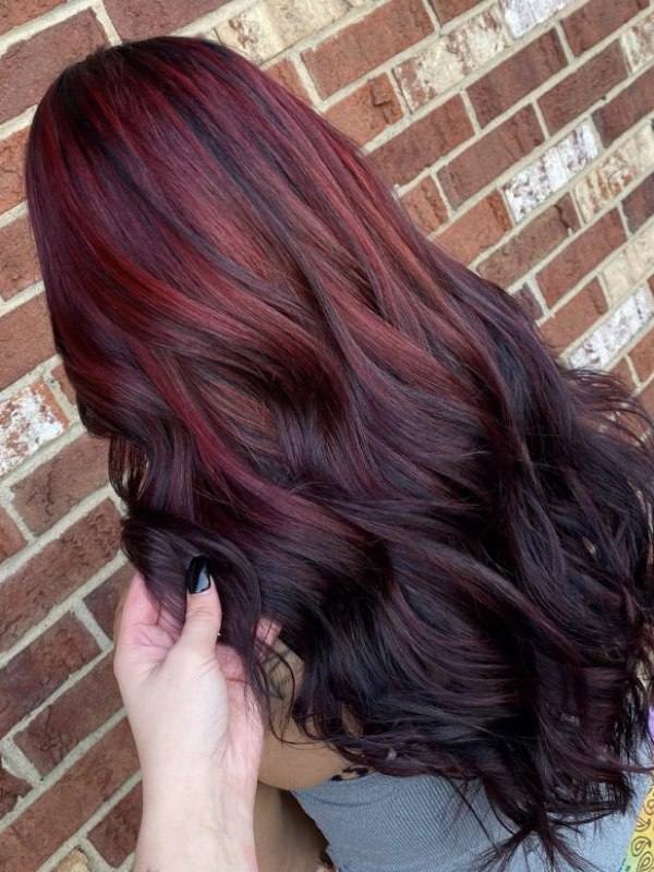 Stand out with an inverted ombre, where brown light burgundy hair color starts at the roots