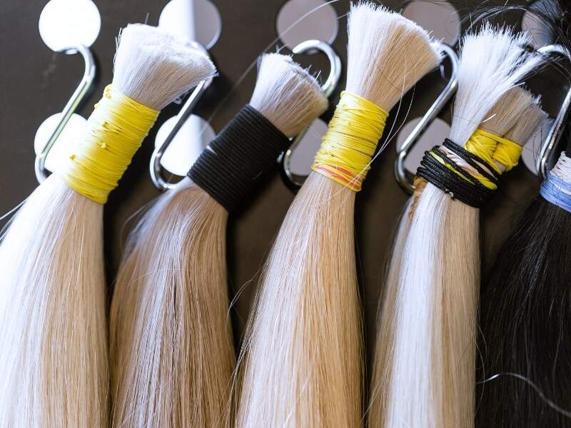 Why is it important to determine "How many grams of hair do you need for extensions?"