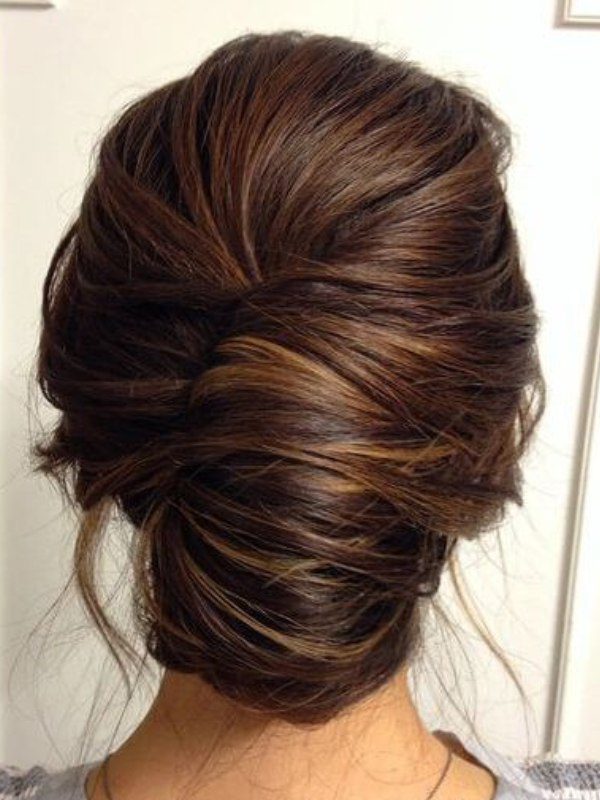 A timeless, elegant French twist that pairs beautifully with light chestnut brown hair color.