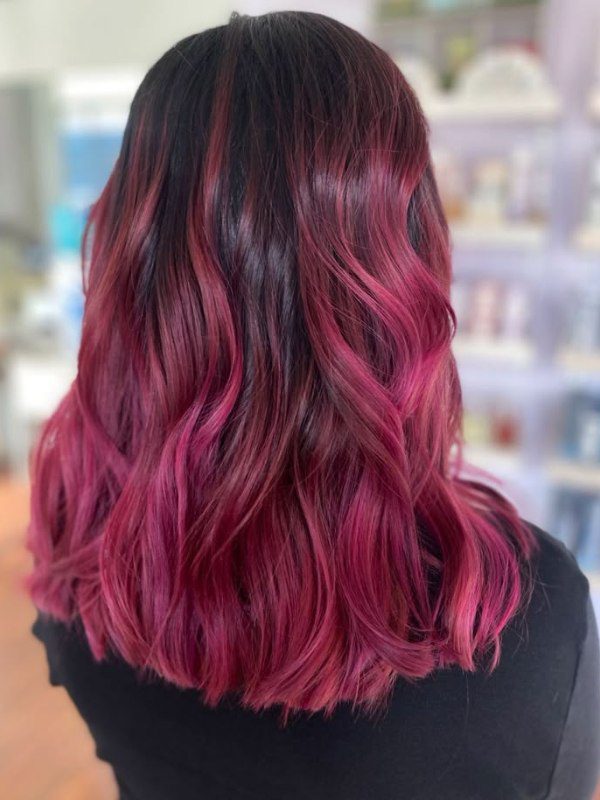 A fun, gradient blend from black roots to soft pink tips