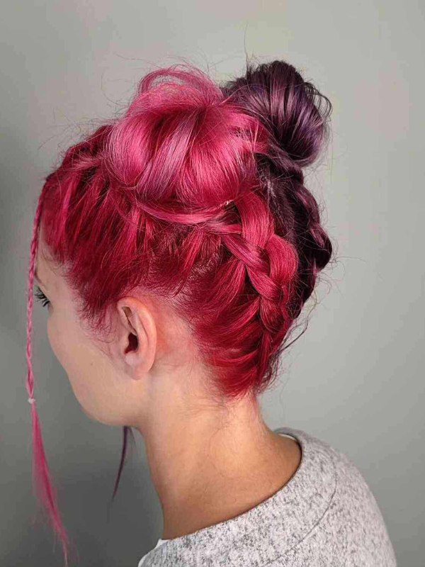 Fun, double buns that showcase bright pink and red hair color