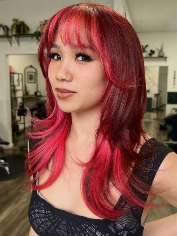 Hidden streaks of pink red hair for a surprise pop of color