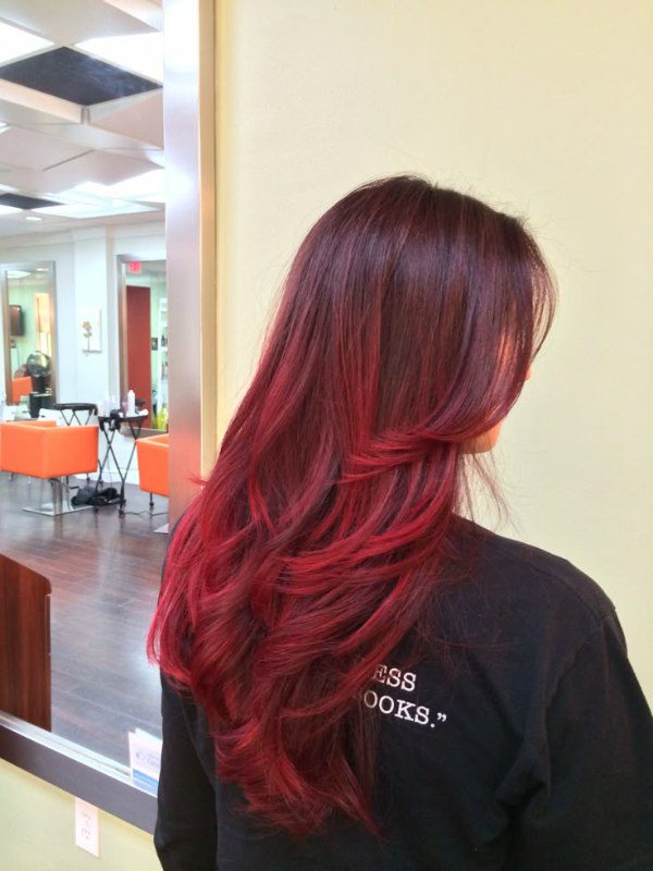 A fiery transition from dark to vibrant red makes a bold statement