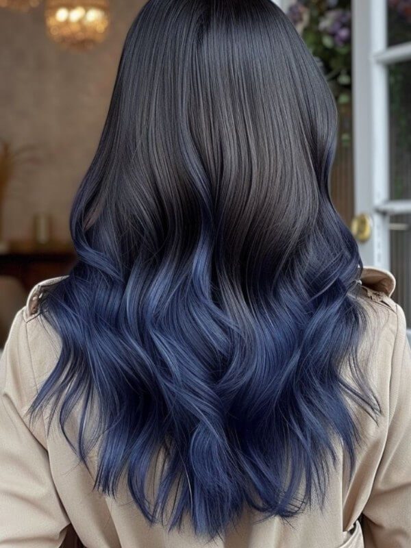 Deep navy, teal, or pastel blue bring a cool, modern vibe to your hair