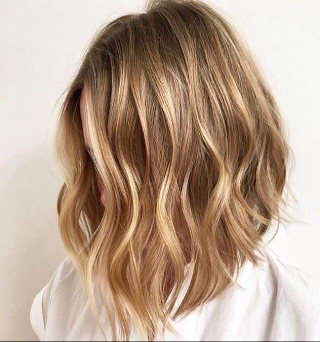 Layer honey lob with soft blonde waves
