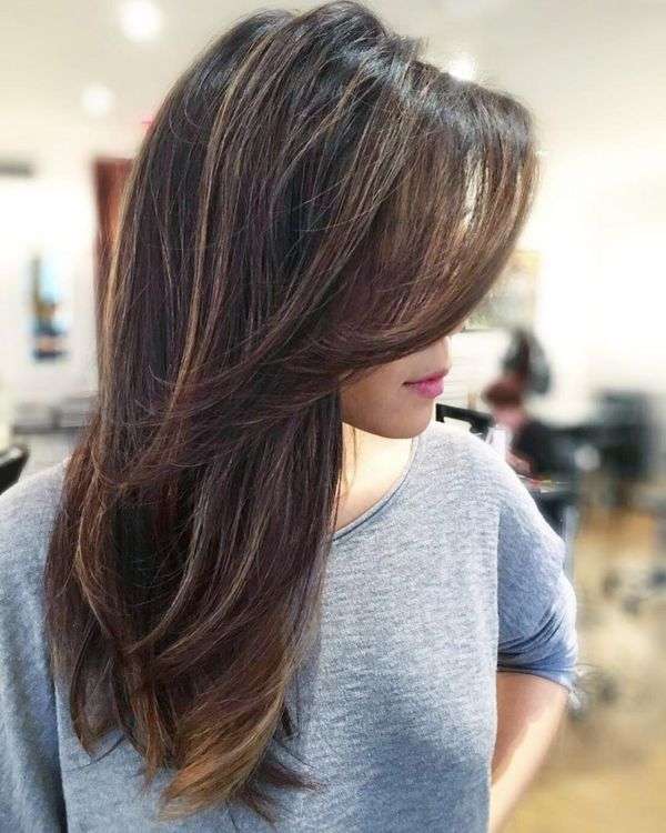 Side swept bangs with long layers
