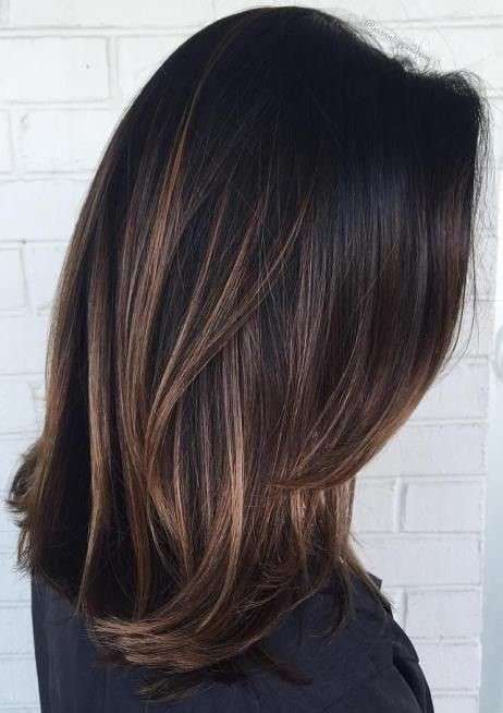 Straight dark brown hair with caramel highlights