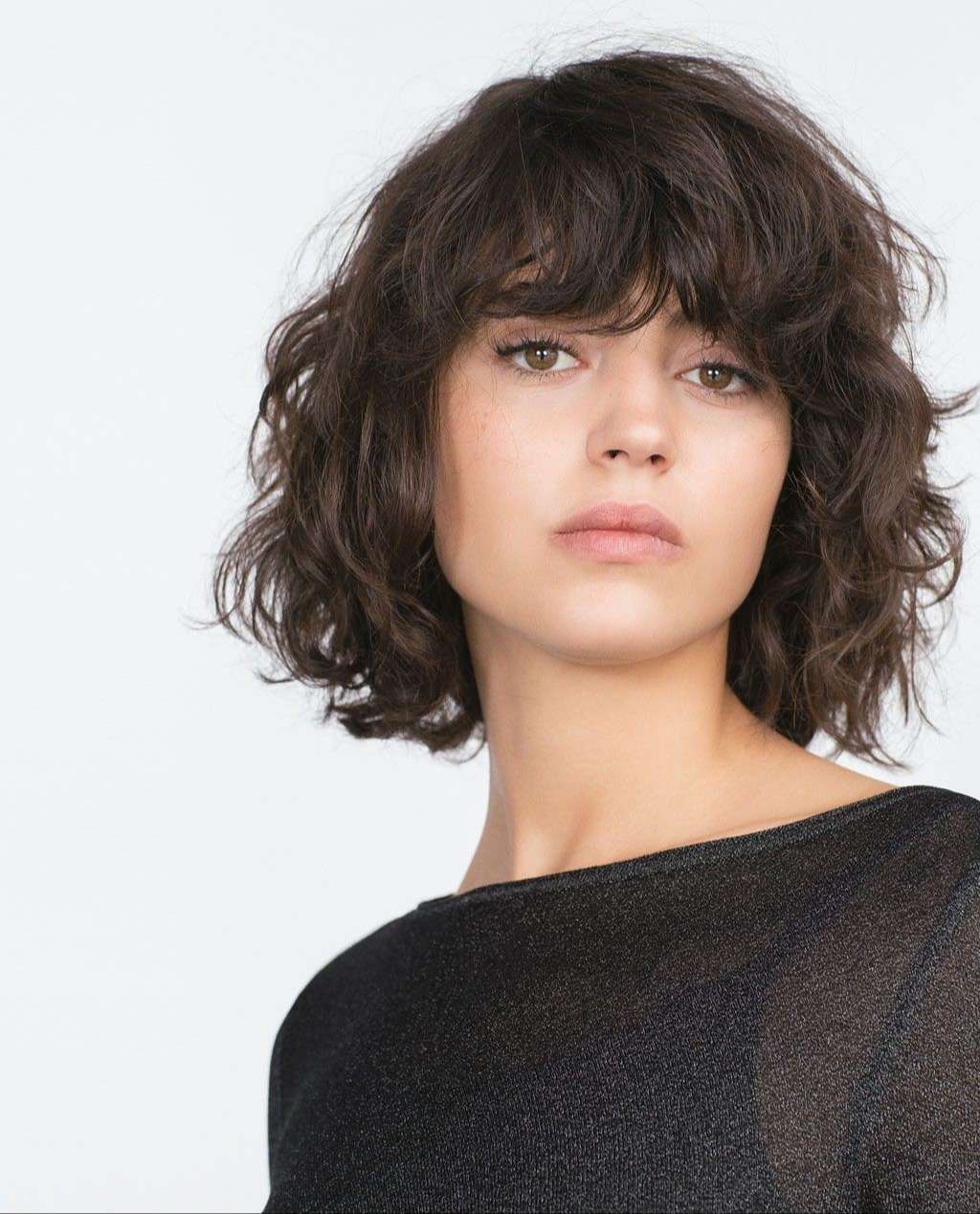 Wild blown wavy bob haircut with curled end fringe
