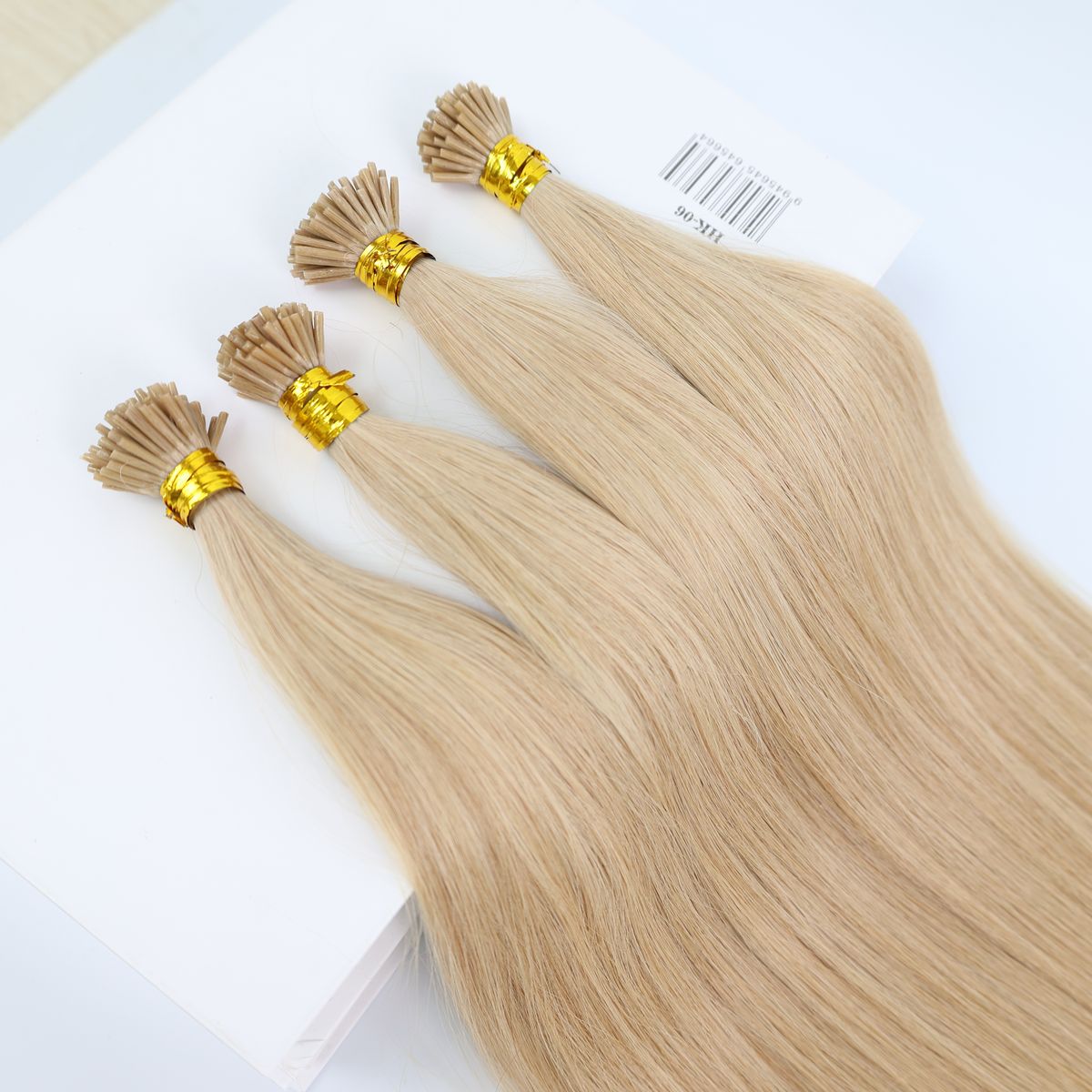 I-tip keratin extensions in honey blonde