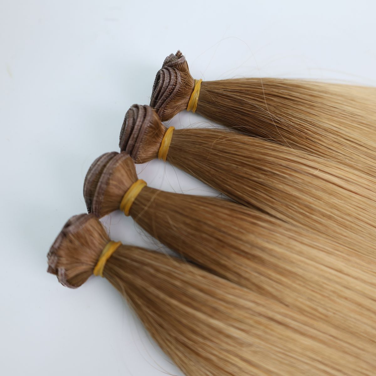 Genius weft hair extensions in an ombre of brown shades