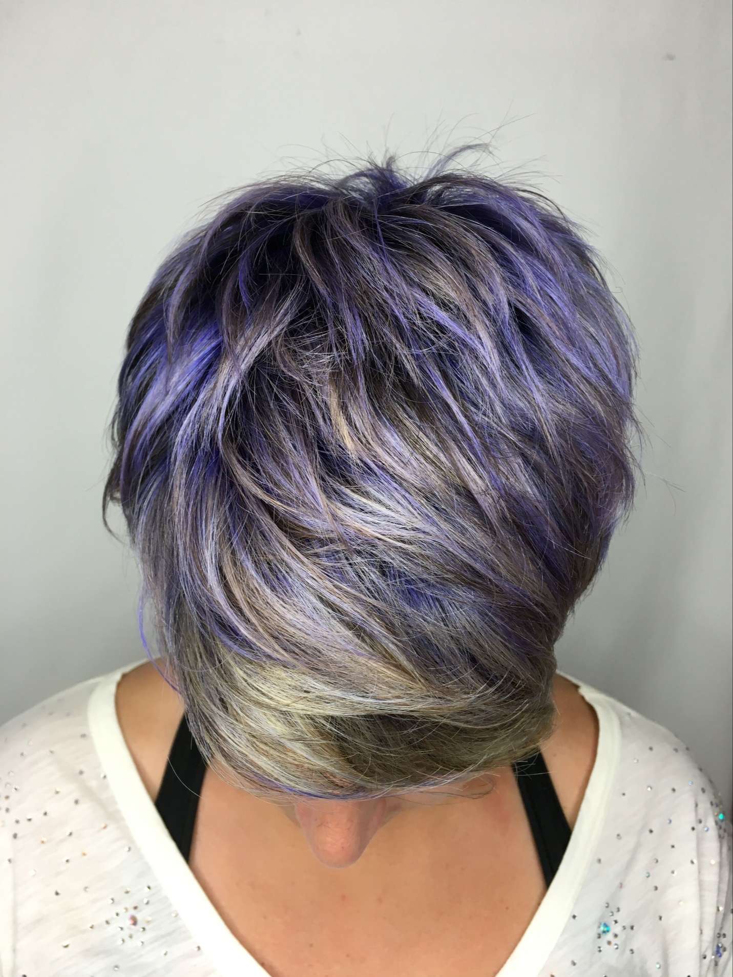 pixie haircut with purple highlights